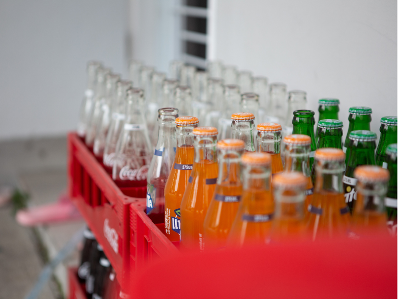 Glass beverage bottles in crates — soft drink bottling and packaging for beverage manufacturing