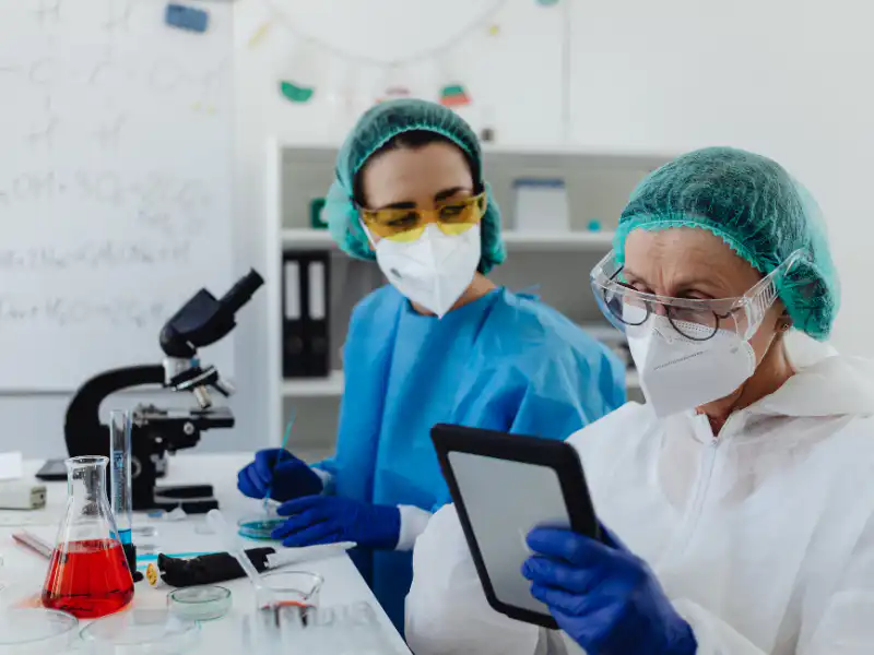 Food scientists conducting quality control testing in a laboratory — sweetener and ingredient safety analysis