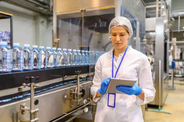 Quality control inspector at a beverage production facility — sucralose applications in food and drink manufacturing